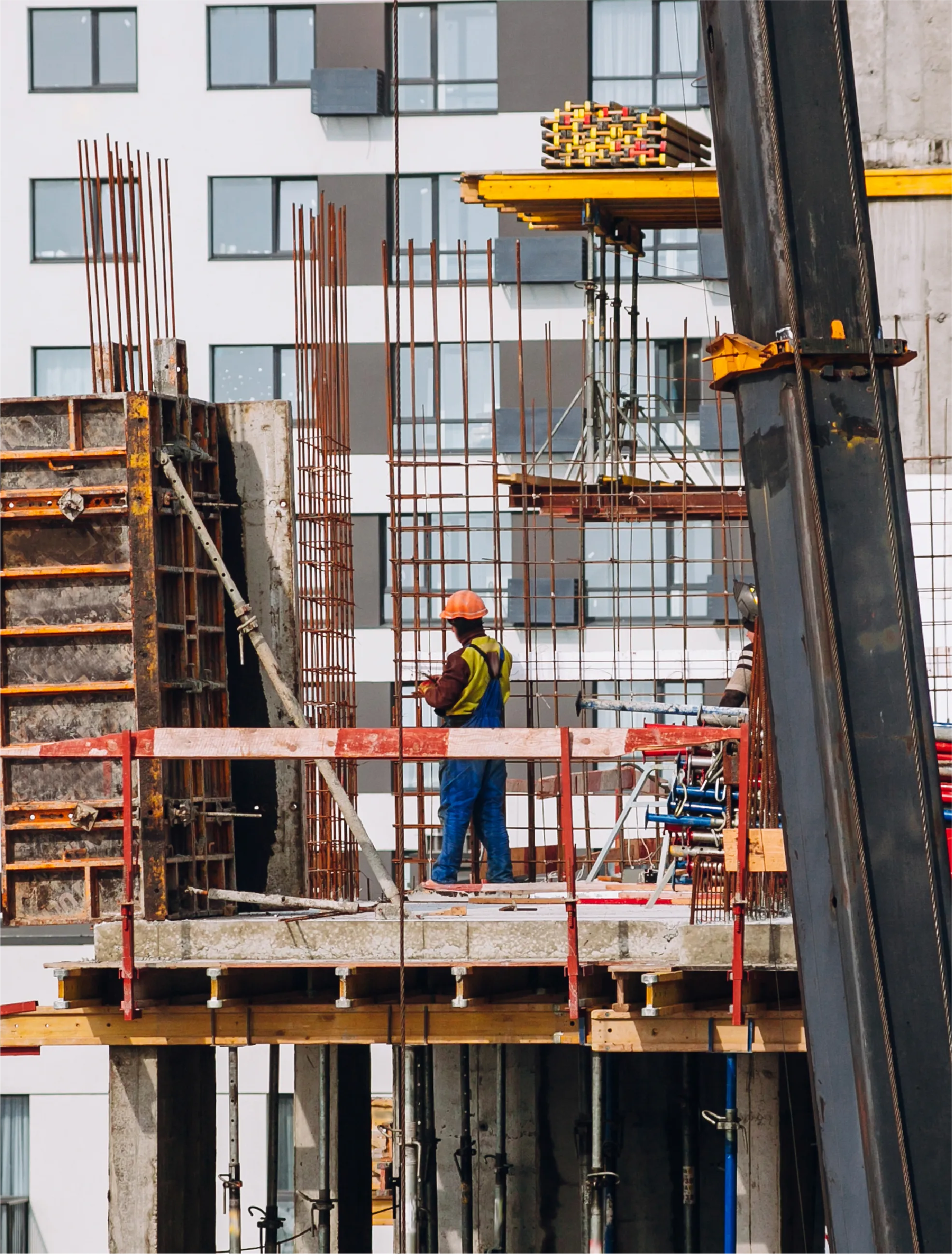 Construction site with workers and cranes